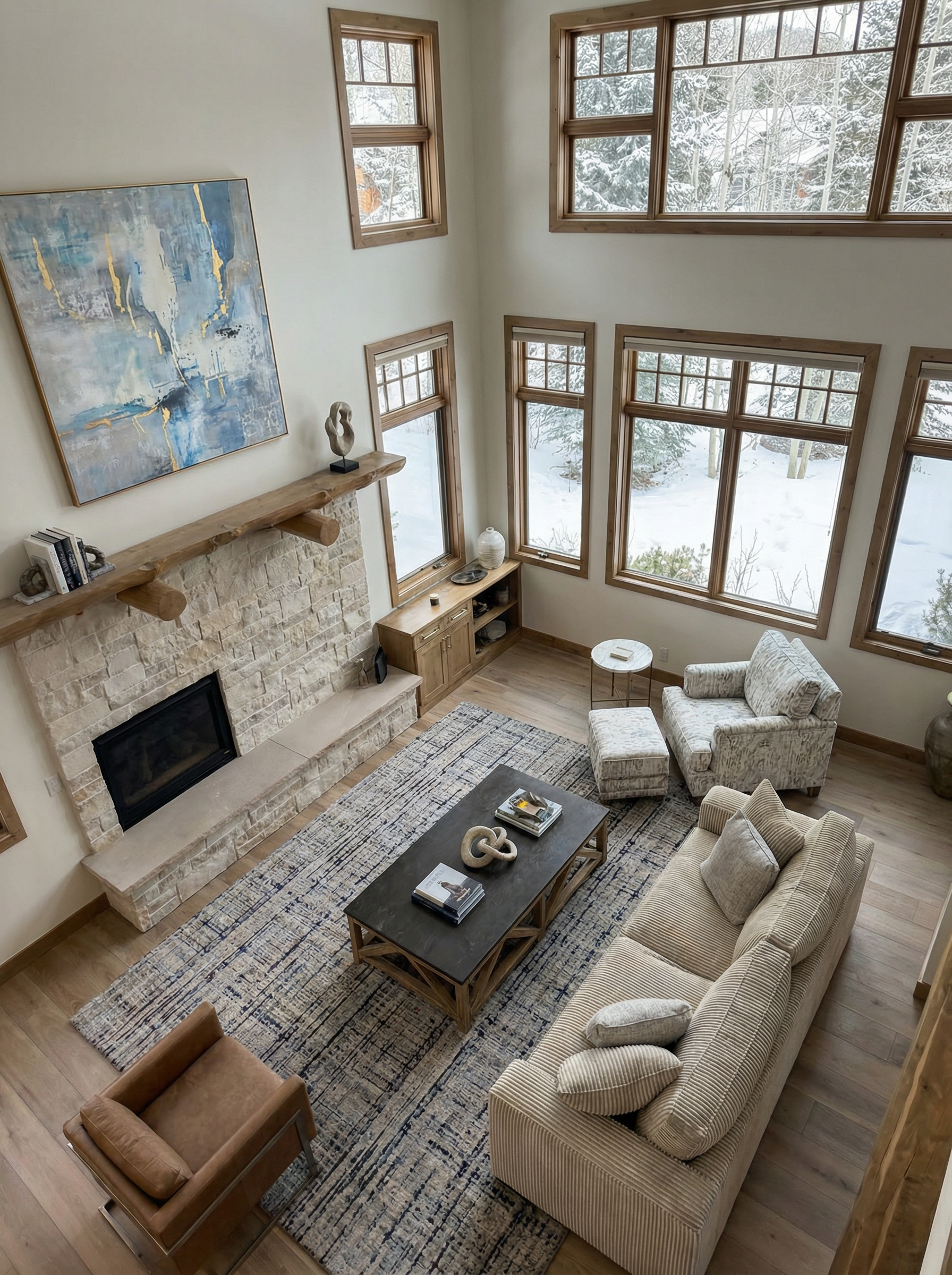 Living room with panoramic mountain views through floor-to-ceiling windows